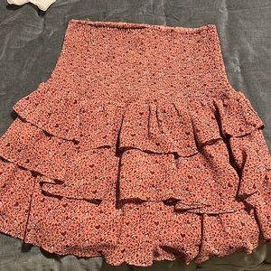 Ruched skirt. High waist ruching with ruffles. Hits mid thigh if worn below ribs